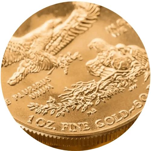 A close-up of a gold coin featuring an eagle and the text "1 OZ FINE GOLD - 50 DOLLARS."