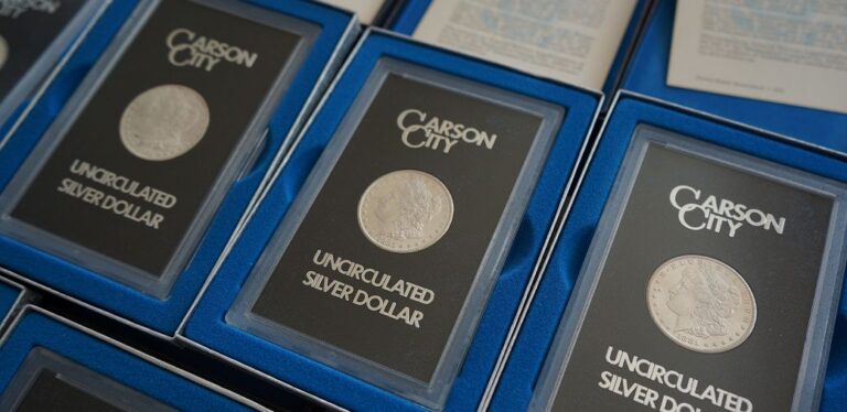 Carson City uncirculated silver dollar coins displayed in protective cases