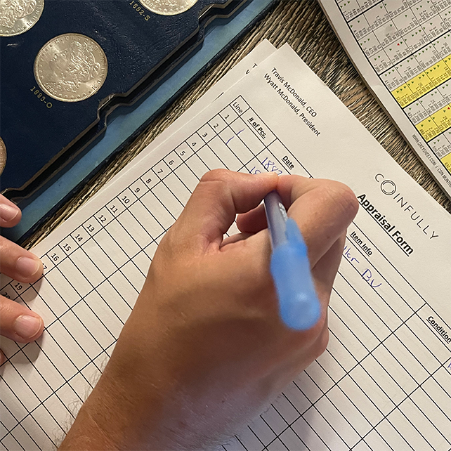 Filling out an appraisal form with a blue pen, coins visible in the background.