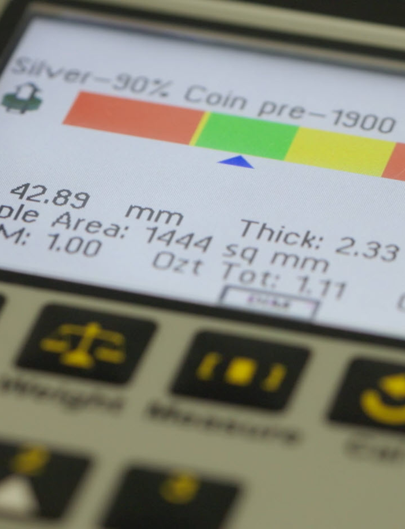 42.89 mm measurement display on a metal testing machine, showing silver content